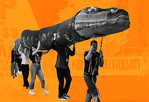 Activists carrying snake prop