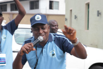 Akinbode Oluwafeme at a rally for Our Water, Our Right coalition.