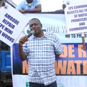 Deputy Executive Director Akinbode Oluwafemi of Environmental Rights Action/Friends of the Earth Nigeria, a Corporate Accountability board member, speaks at a massive rally for the human right to water in Lagos.