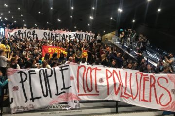 Hundreds call for just climate policy at sit in at the end of COP24.