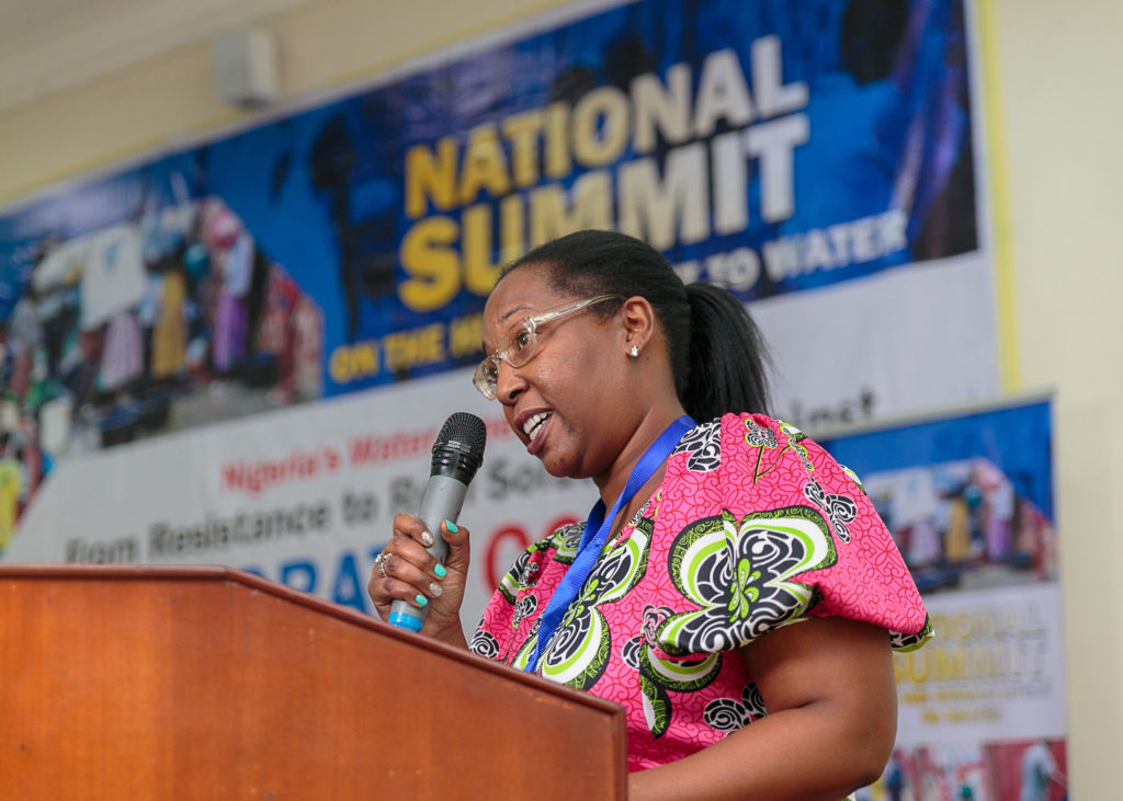Gina Luster, activist with Flint Rising from Flint, Michigan, speaks to attendees at the National Water Summit in Abuja, Nigeria. CREDIT: BABAWALE OBAYANJU