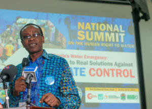 Nnimmo Bassey, board chair of Enviromental Rights Action/Friends of the Earth Nigeria, speaks to attendees at the National Water Summit in Abuja, Nigeria. CREDIT: BABAWALE OBAYANJU