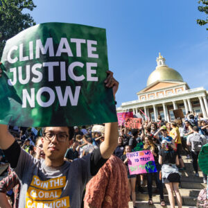 People gather at the State House in Boston, MA during the Youth Climate Strike.
