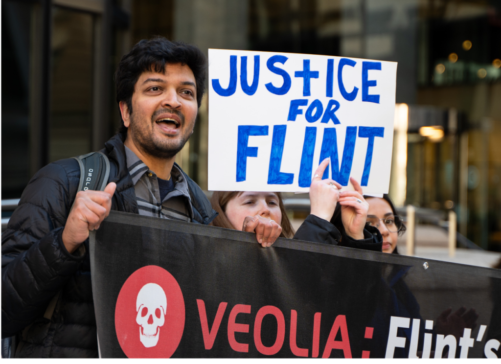 Organizers lead action in city, holding banners and signs that read Justice for Flint. 