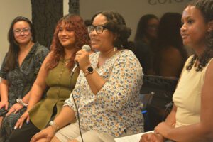 Three people during a panel discussion